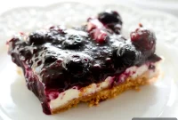 Creamy Blueberry Cheesecake Bars with Golden Crust