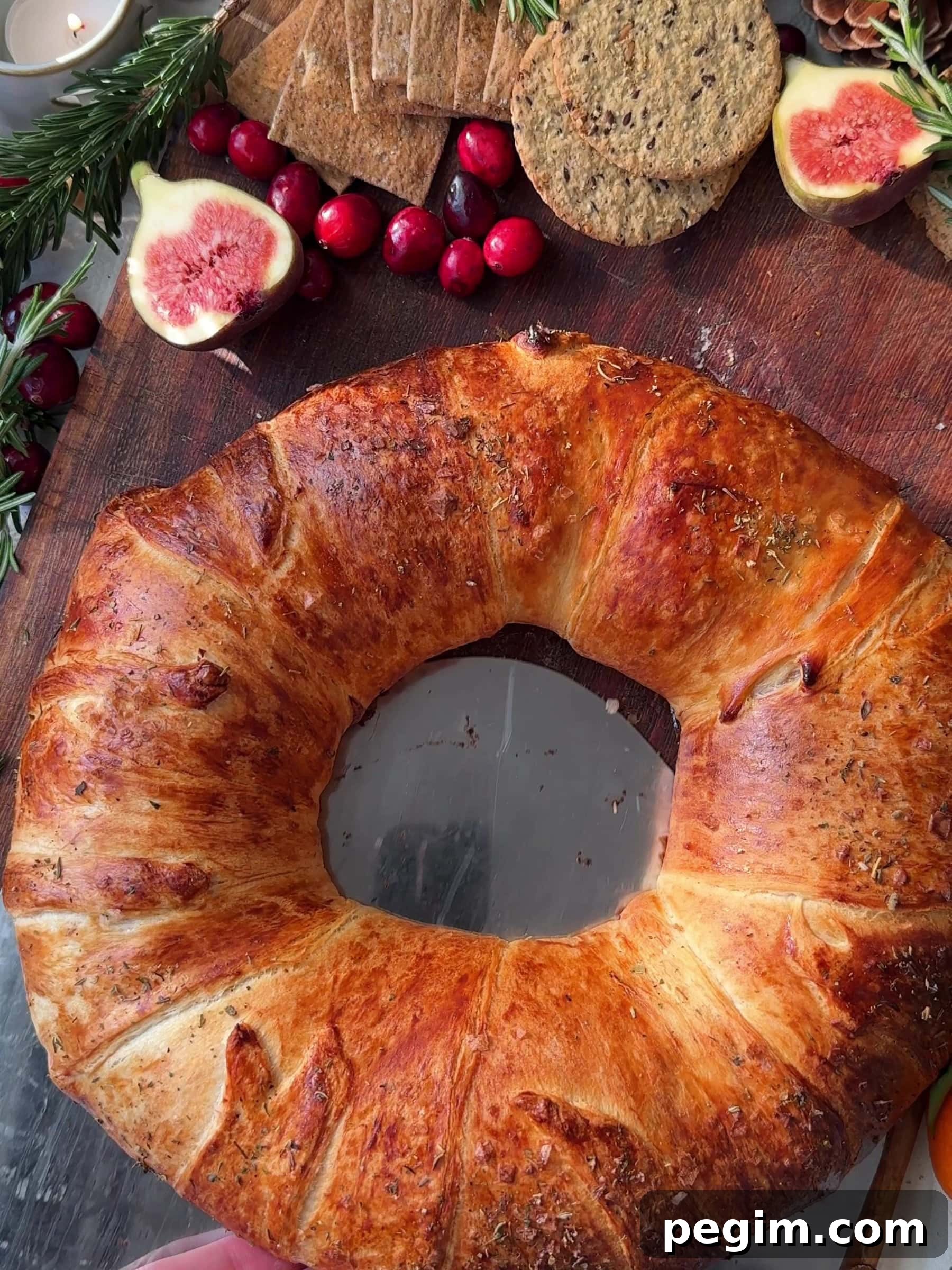 Serving the Brie Crescent Wreath with fresh figs
