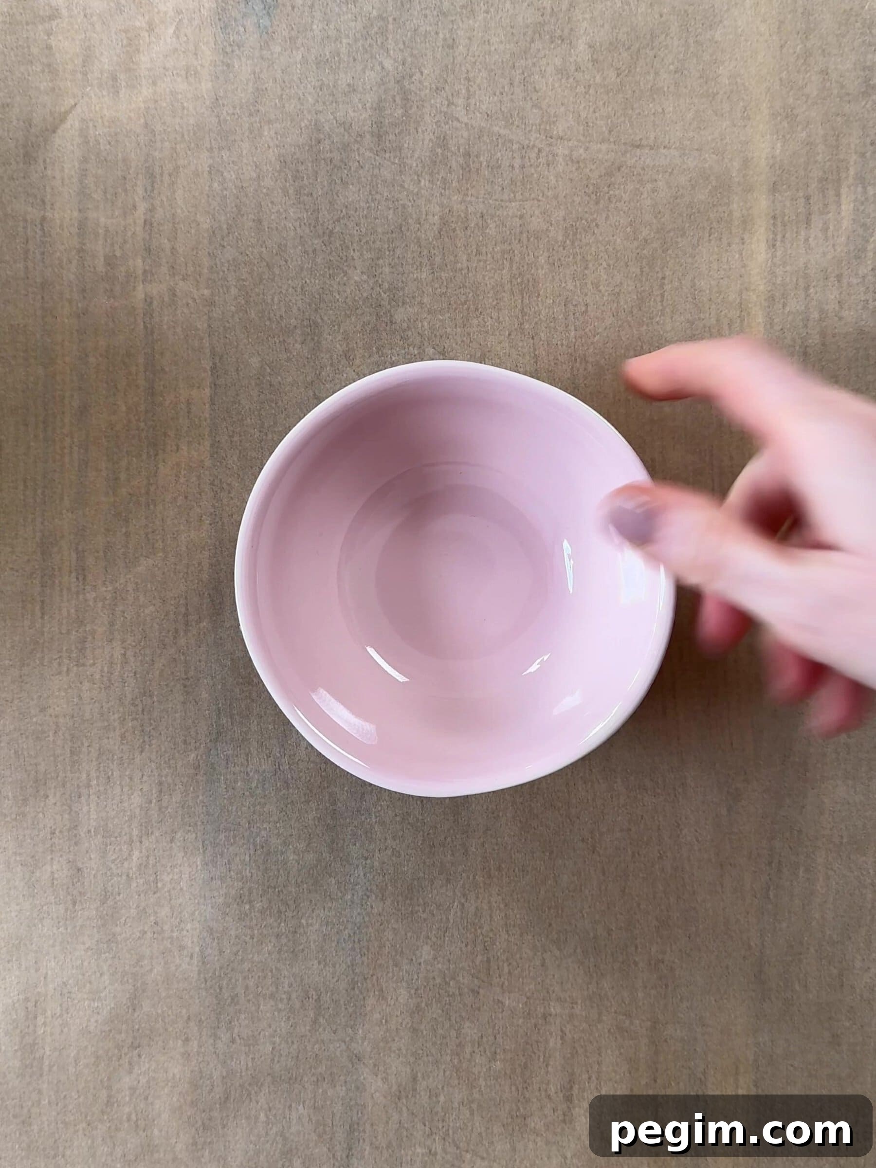A ramekin on a baking sheet