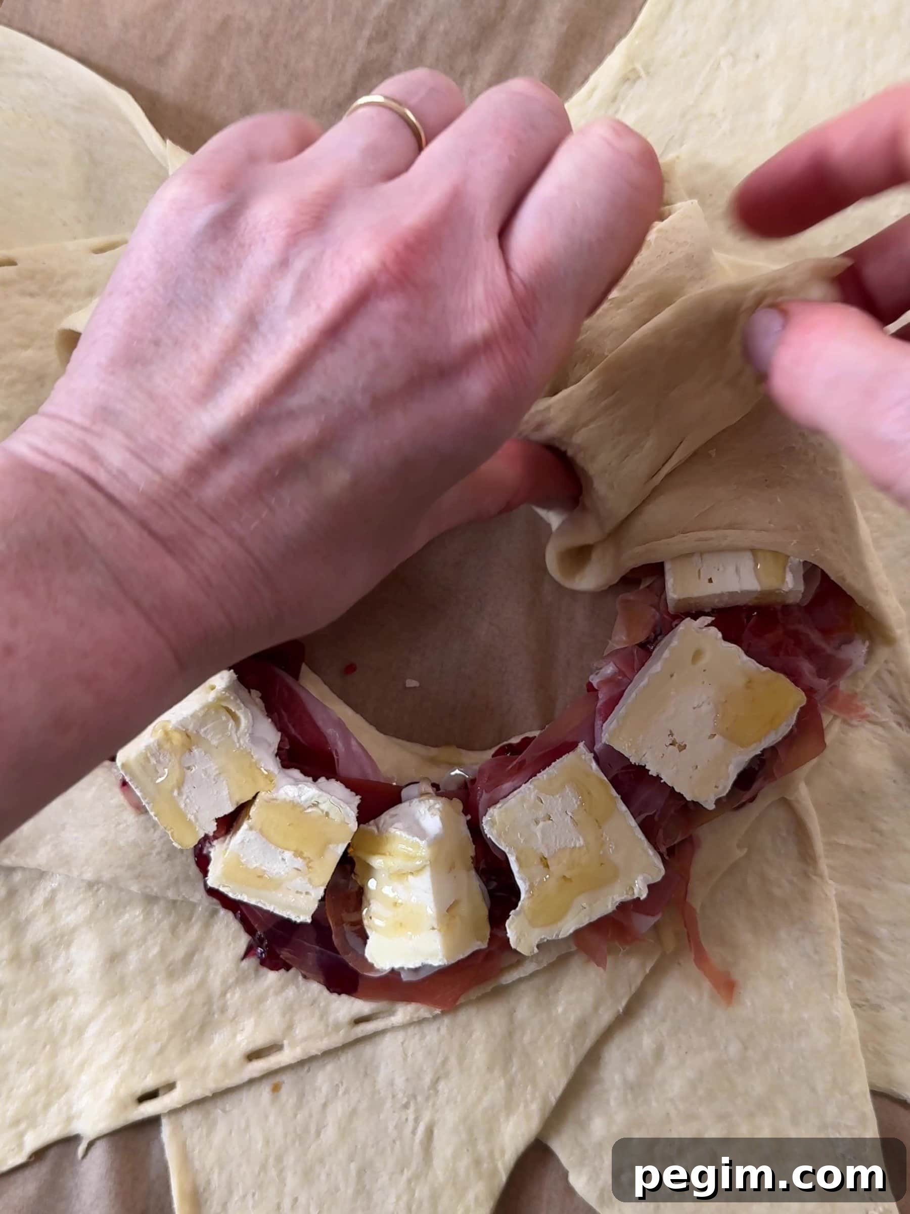 Folding the dough over the filling.