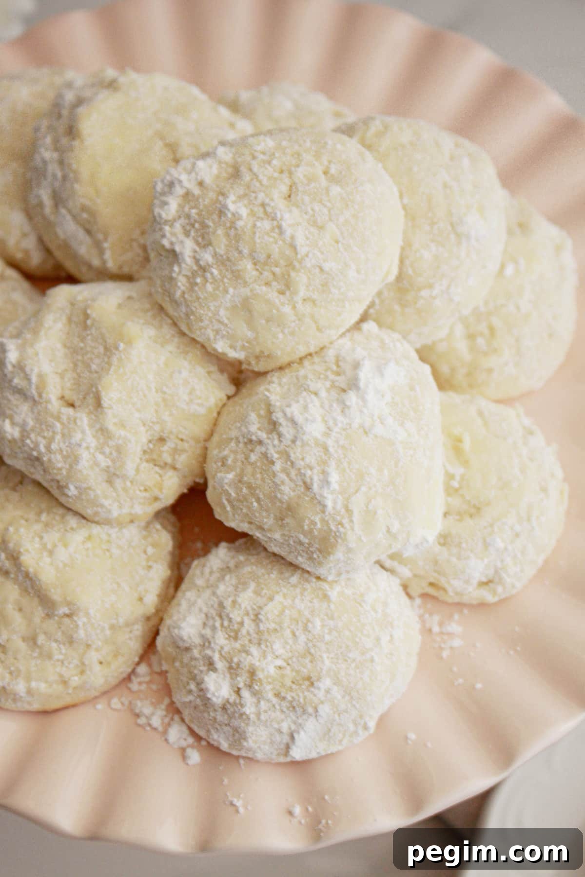Plate full of cream cheese cookies.