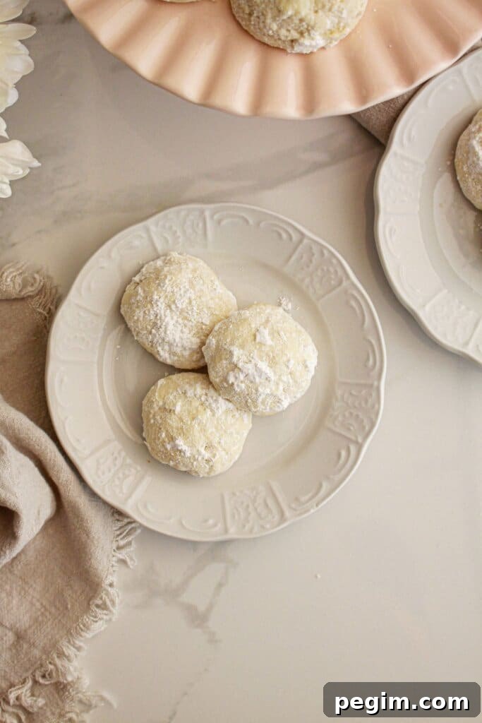 Snowball cookies on a plate.