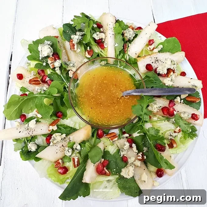 Christmas Wreath Pear Salad is a refreshing salad addition to your Christmas menu, with pears, nuts, pomegranates and more - Prepping to serving within minutes