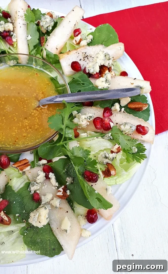Christmas Wreath Pear Salad is a refreshing salad addition to your Christmas menu, with pears, nuts, pomegranates and more - Prepping to serving within minutes