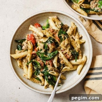Two bowls of tuna pesto pasta.