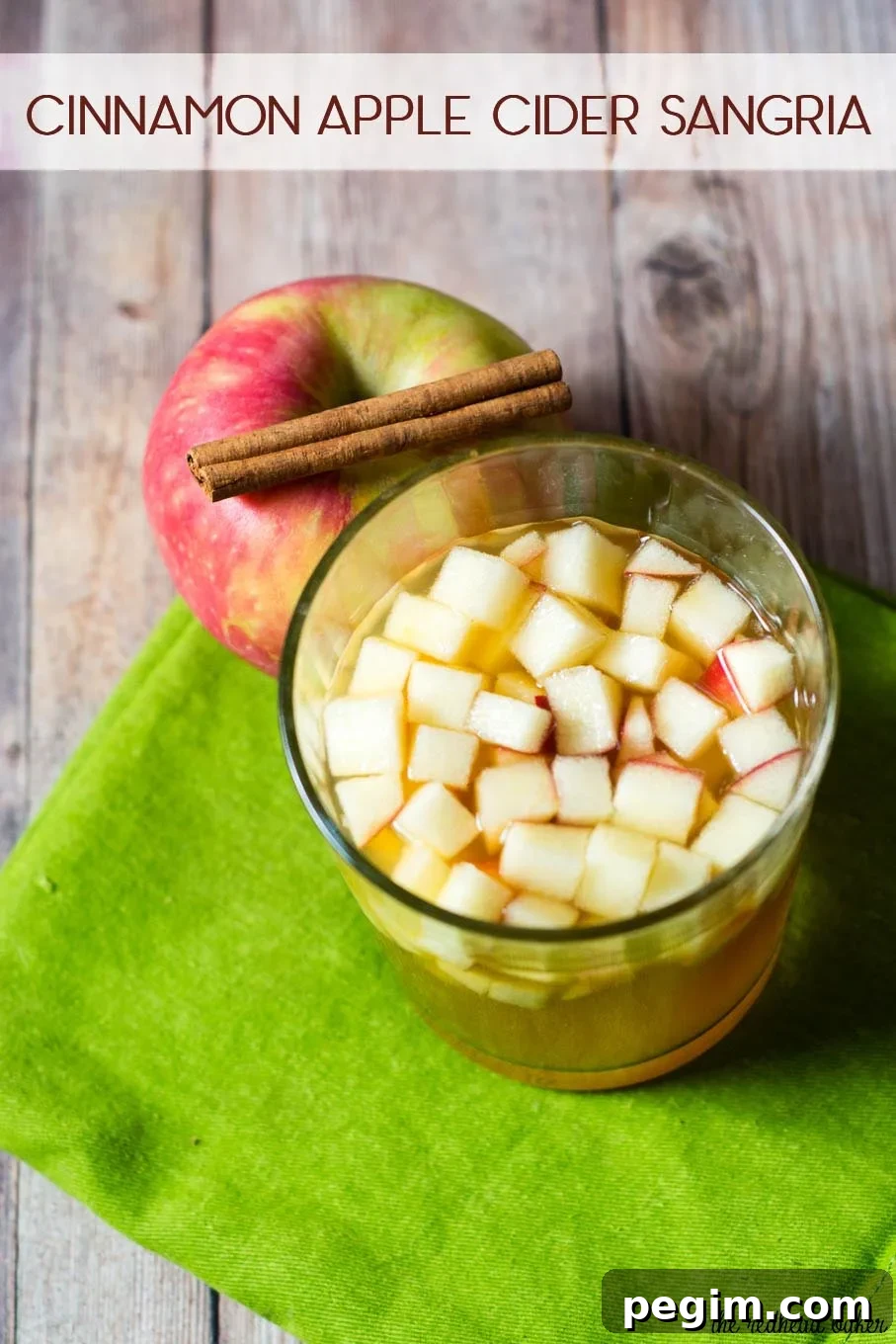 Cinnamon apple cider sangria is a delicious fall cocktail combining white wine, apple cider, apple brandy and cinnamon whiskey. #AppleWeek