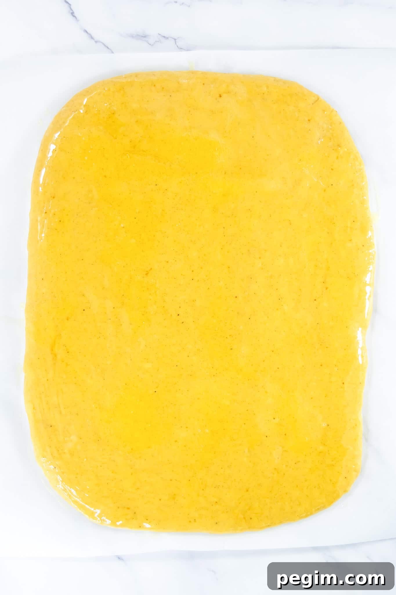 Butter brushed on rolled out dough