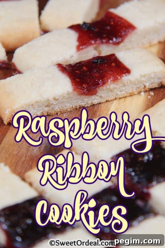 Raspberry Ribbon Cookies are a delicate, buttery dessert with a splash of raspberry jam.