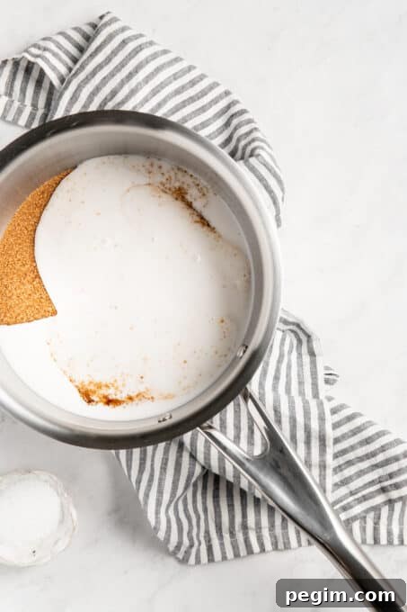 Brown sugar mixed with coconut milk in a pan.