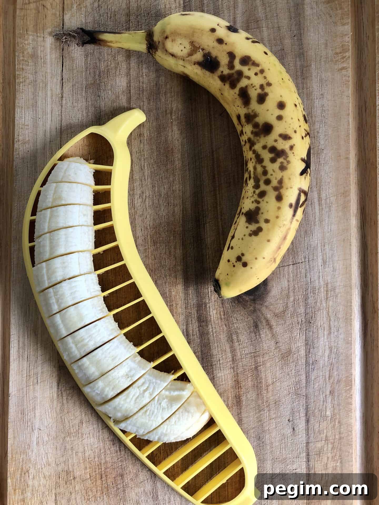 Bananas being sliced with a banana slicer