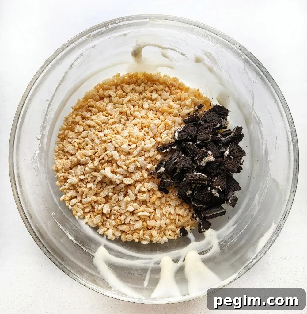 add in the rice krispie cereal and chopped oreos
