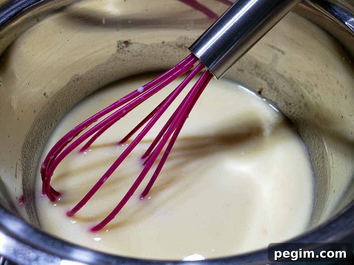 lasagna white sauce cooking in a pan