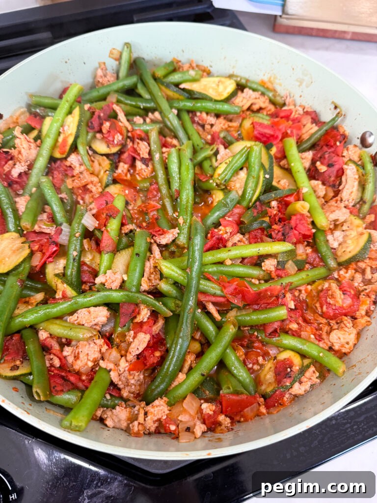 add tomatoes to the turkey and veggies