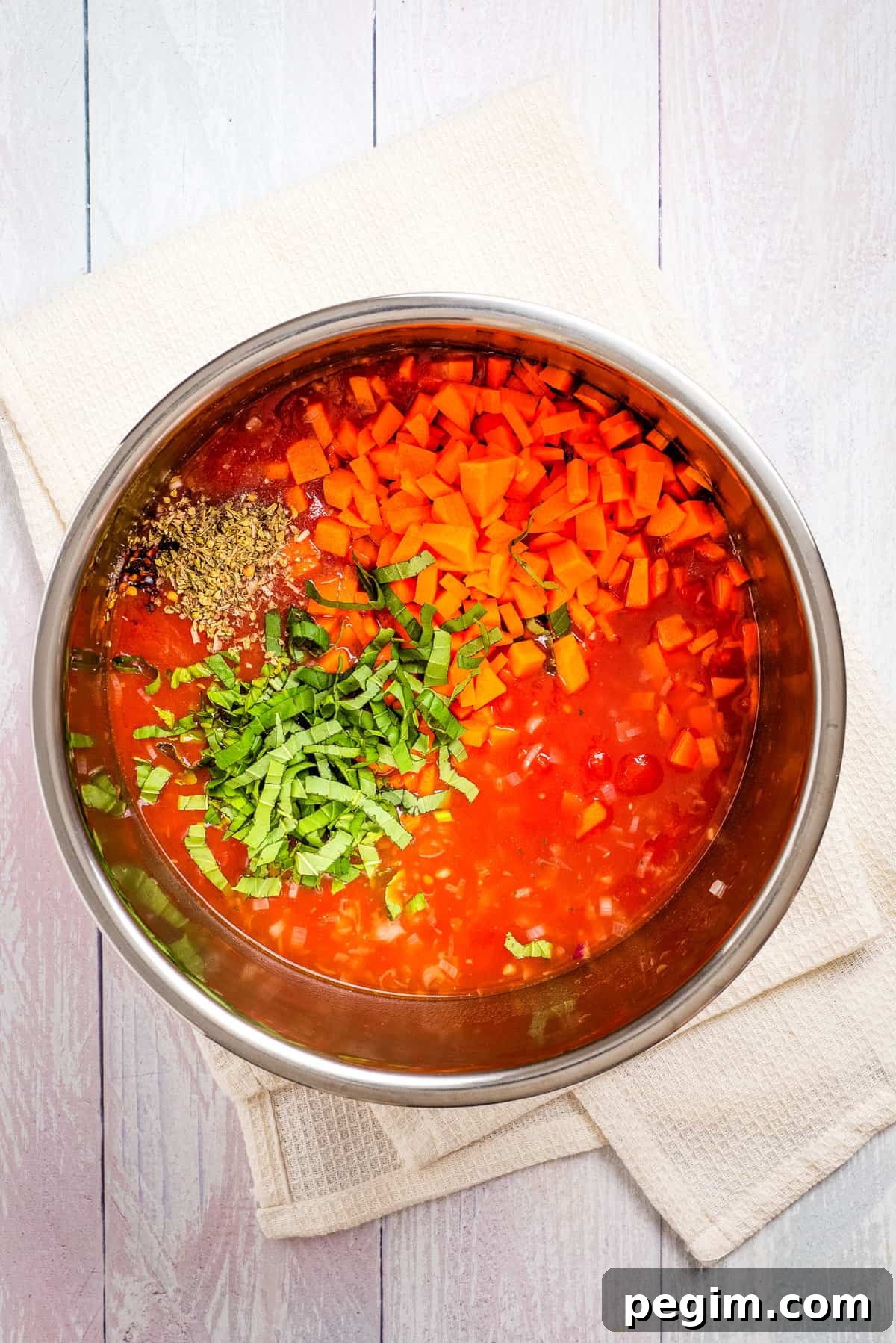 Overhead view of uncooked instant pot tomato soup added with
