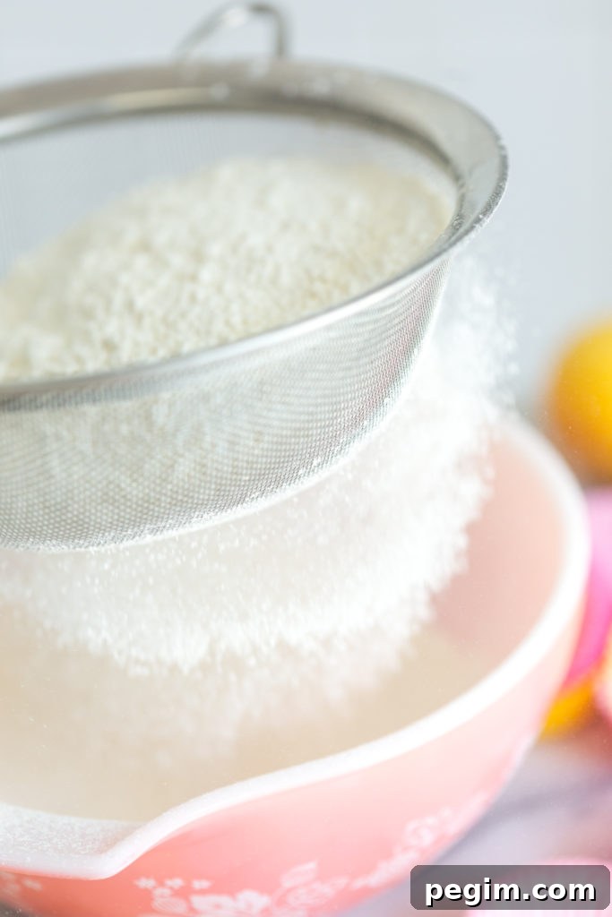 Mini Strawberry Lemon Cupcakes - sifting dry ingredients