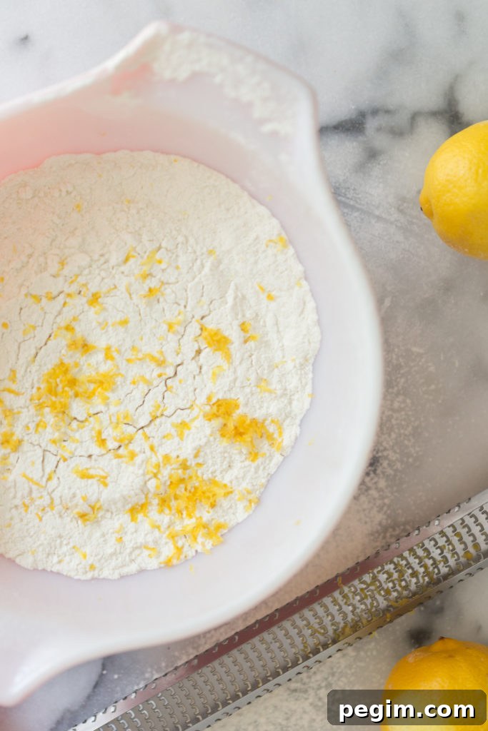 Mini Strawberry Lemon Cupcakes- whisking in lemon zest