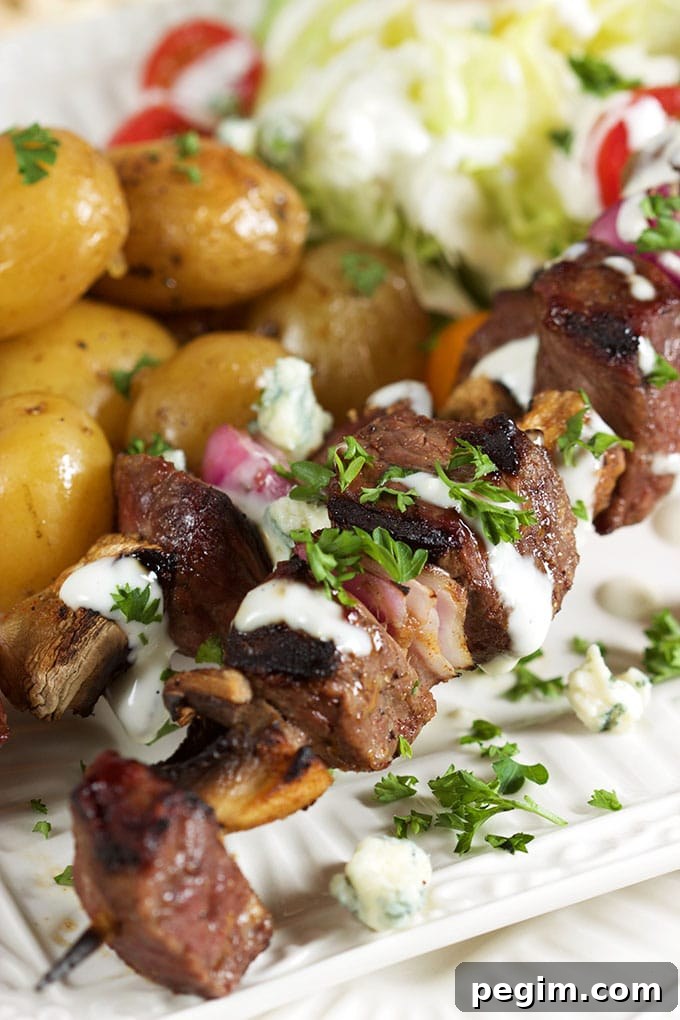 Quick and easy, Grilled Steak and Mushroom Kabobs with Blue Cheese Dressing is the perfect summer dinner for busy weeknights! | TheSuburbanSoapbox.com
