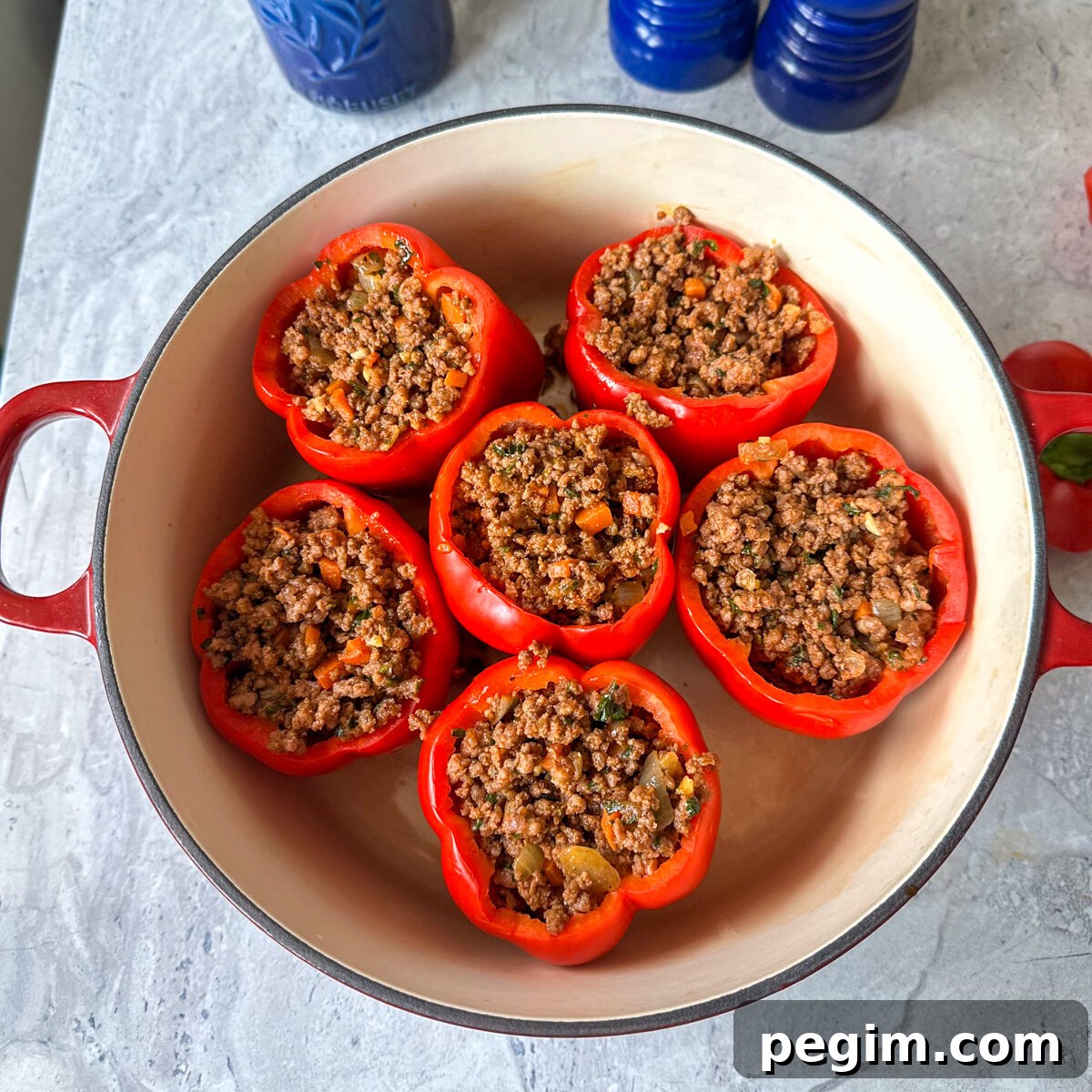 Make the meat mixture & fill each pepper up with meat!