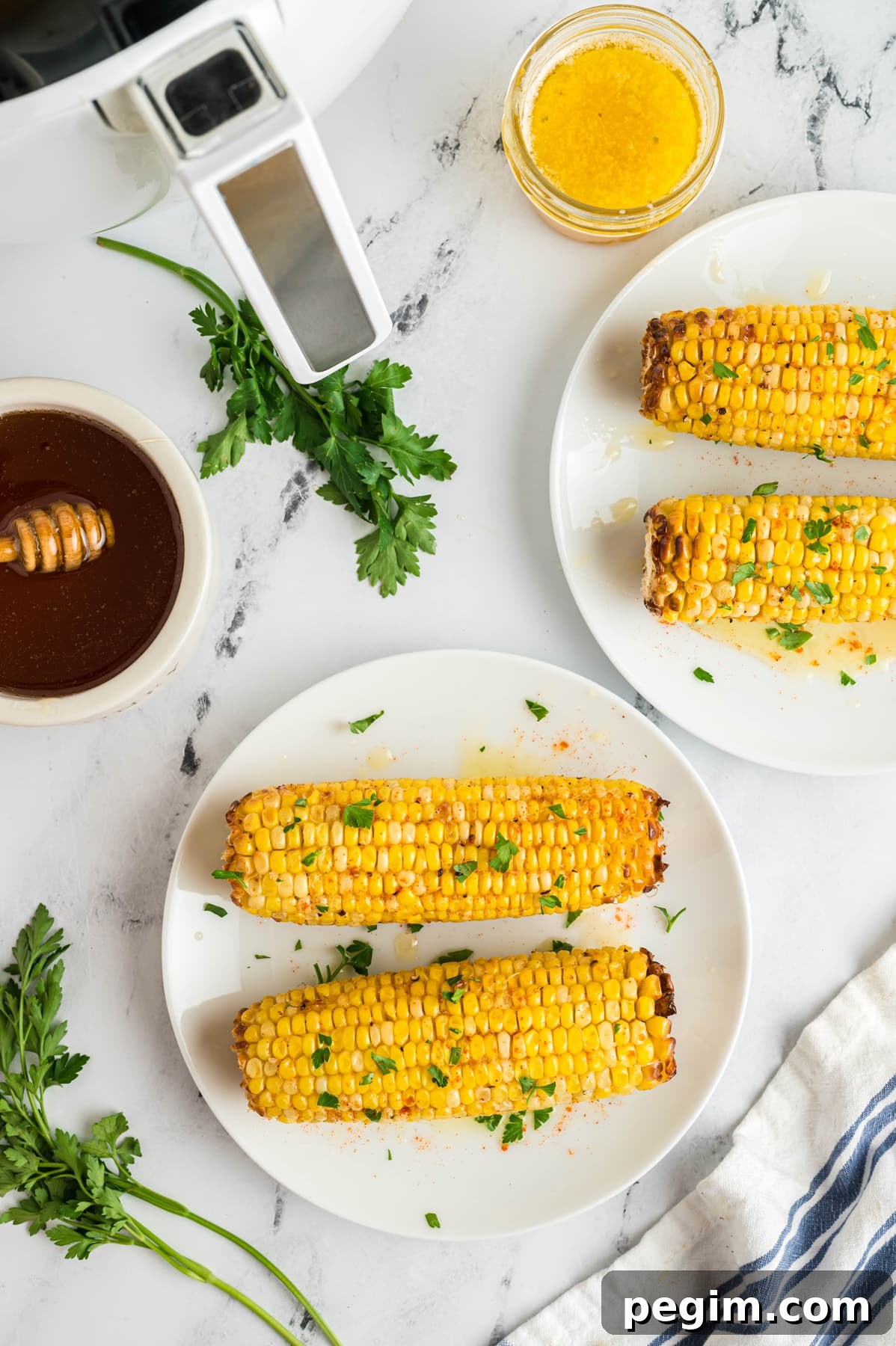Crispy Air Fryer Corn on the Cob Recipe 8 air fryer corn on the cob with butter and parsley