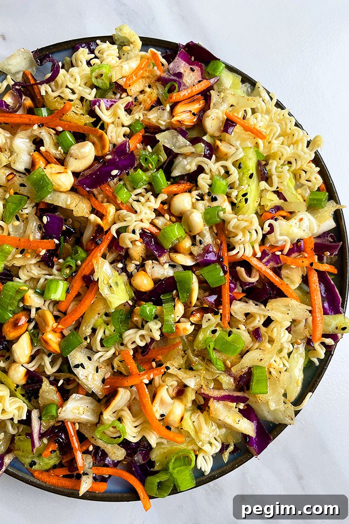 Easy Chinese Ramen Noodle Salad in Black Dish on White Background