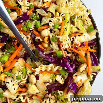 Easy Asian Ramen Noodle Salad in Black Dish on White Background