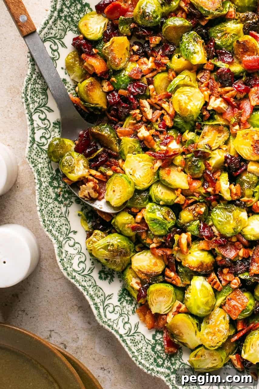 a close up shot of maple bacon brussels sprouts on a serving platter