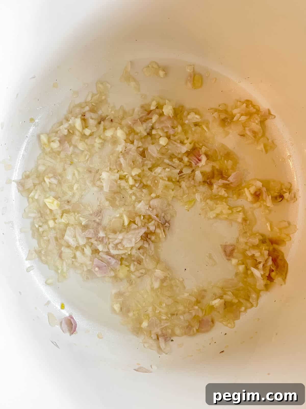 Onions and garlic in a pan.