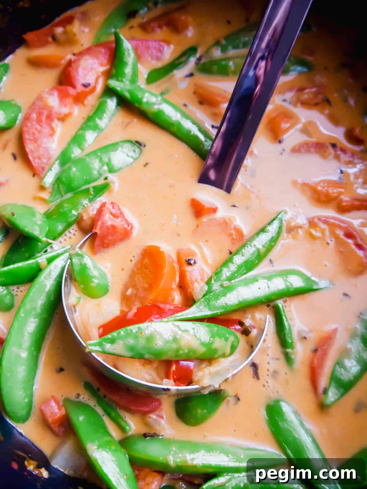 Snap peas added to paleo Thai red curry.