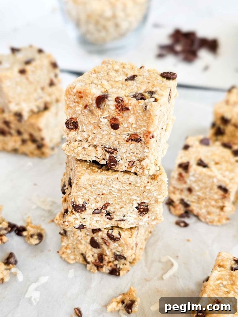 a stack of Heavenly Hunks copycats, with little pieces of dough and a parchment paper backdrop
