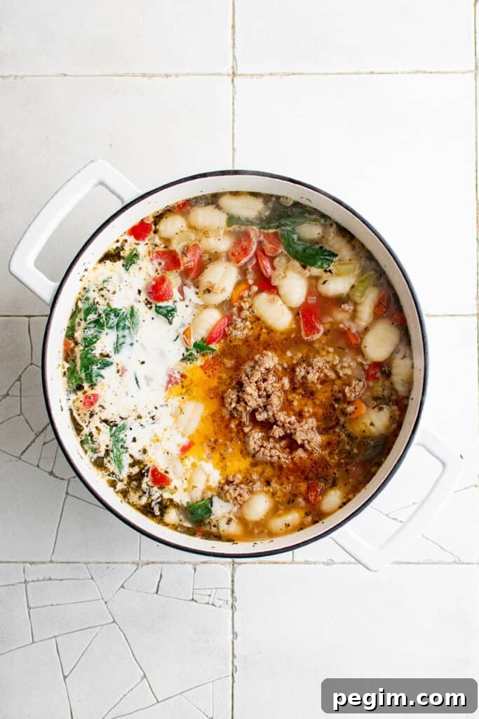 Gnocchi soup with sausage in a pot