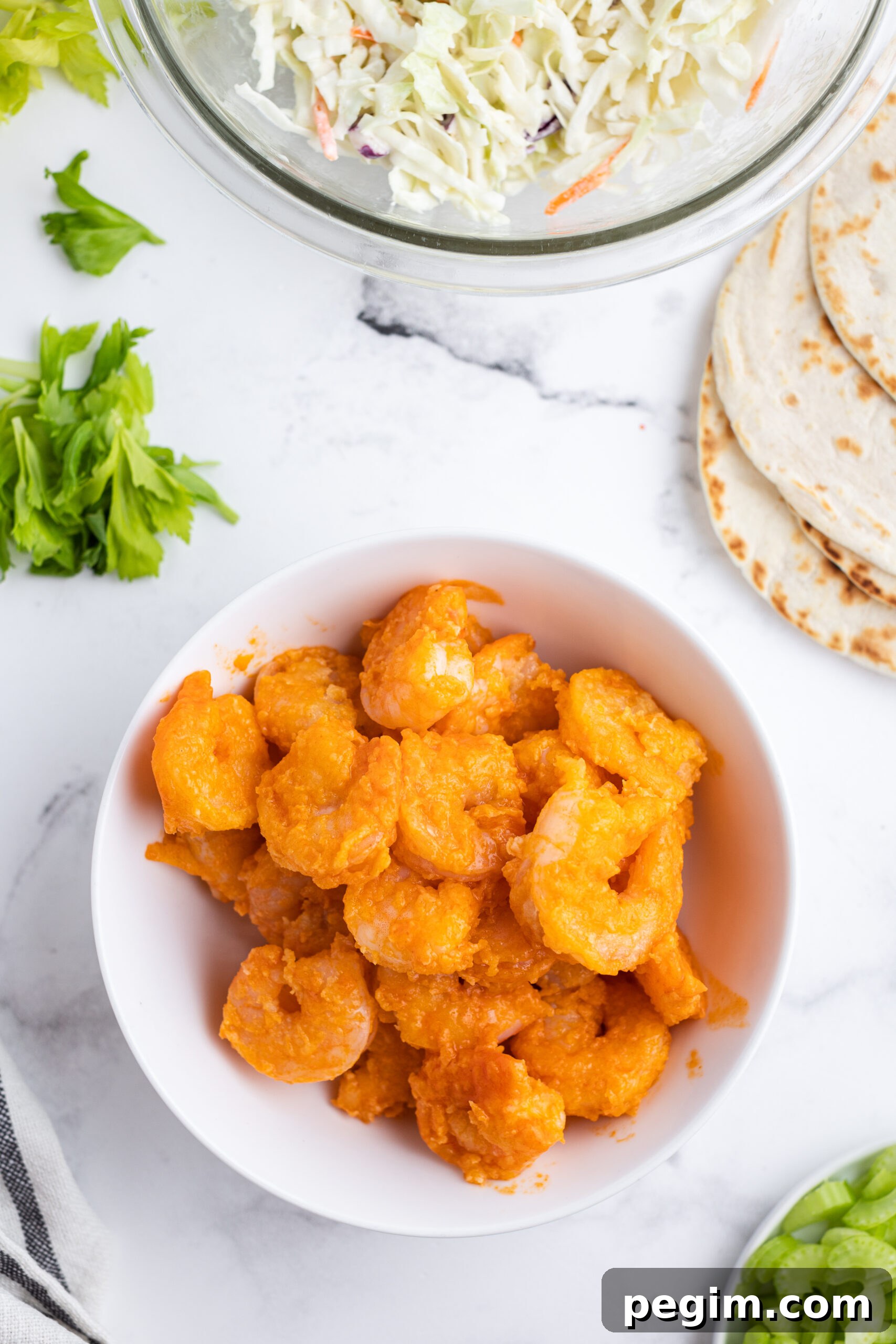Cooked shrimp tossed in homemade buffalo sauce.
