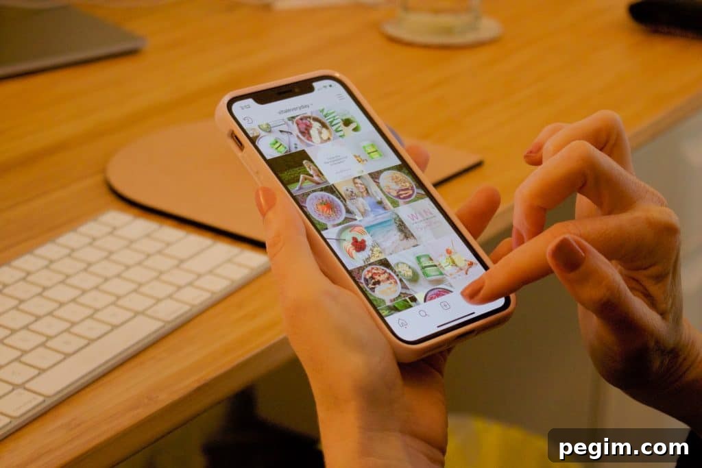 close-up of woman's hands scrolling on Instagram or social media on her phone