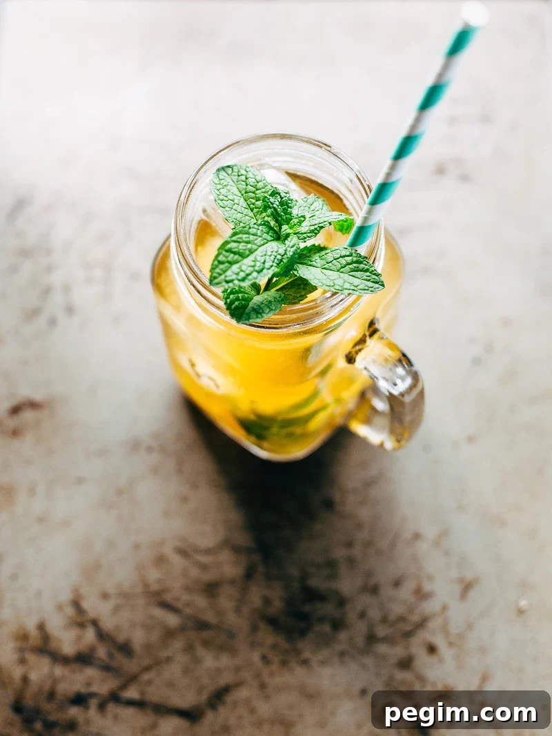 Peach iced tea topped with mint