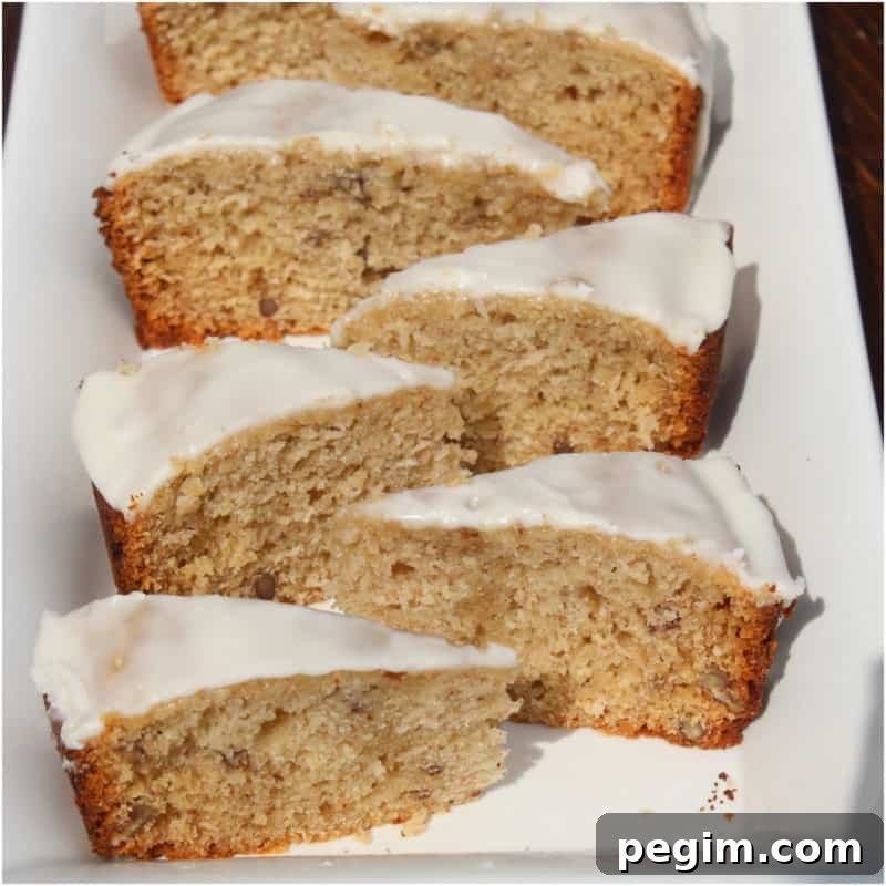 Slices of bourbon banana bread on a white platter