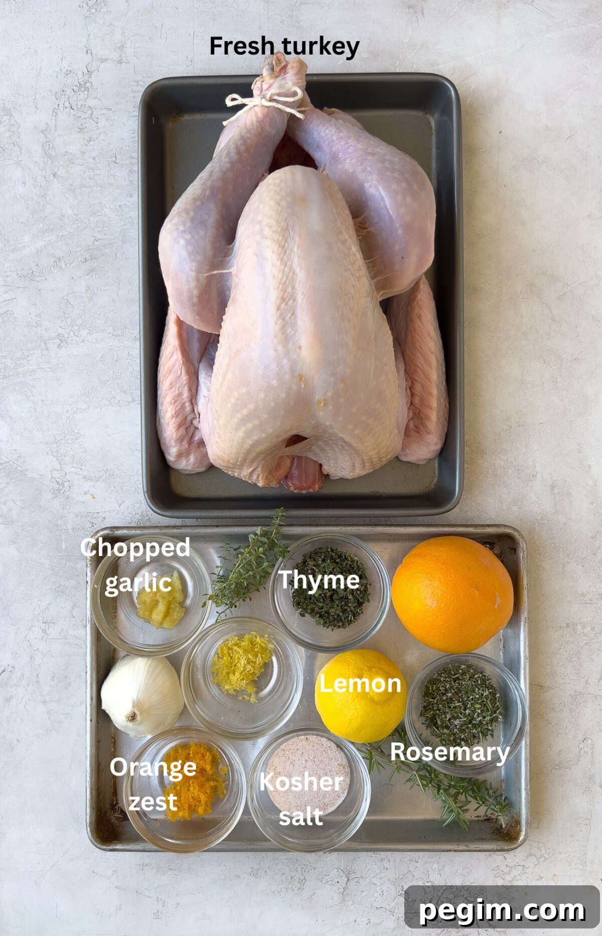 Ingredients for brining a turkey with salt, citrus, herbs, garlic, and the bird.