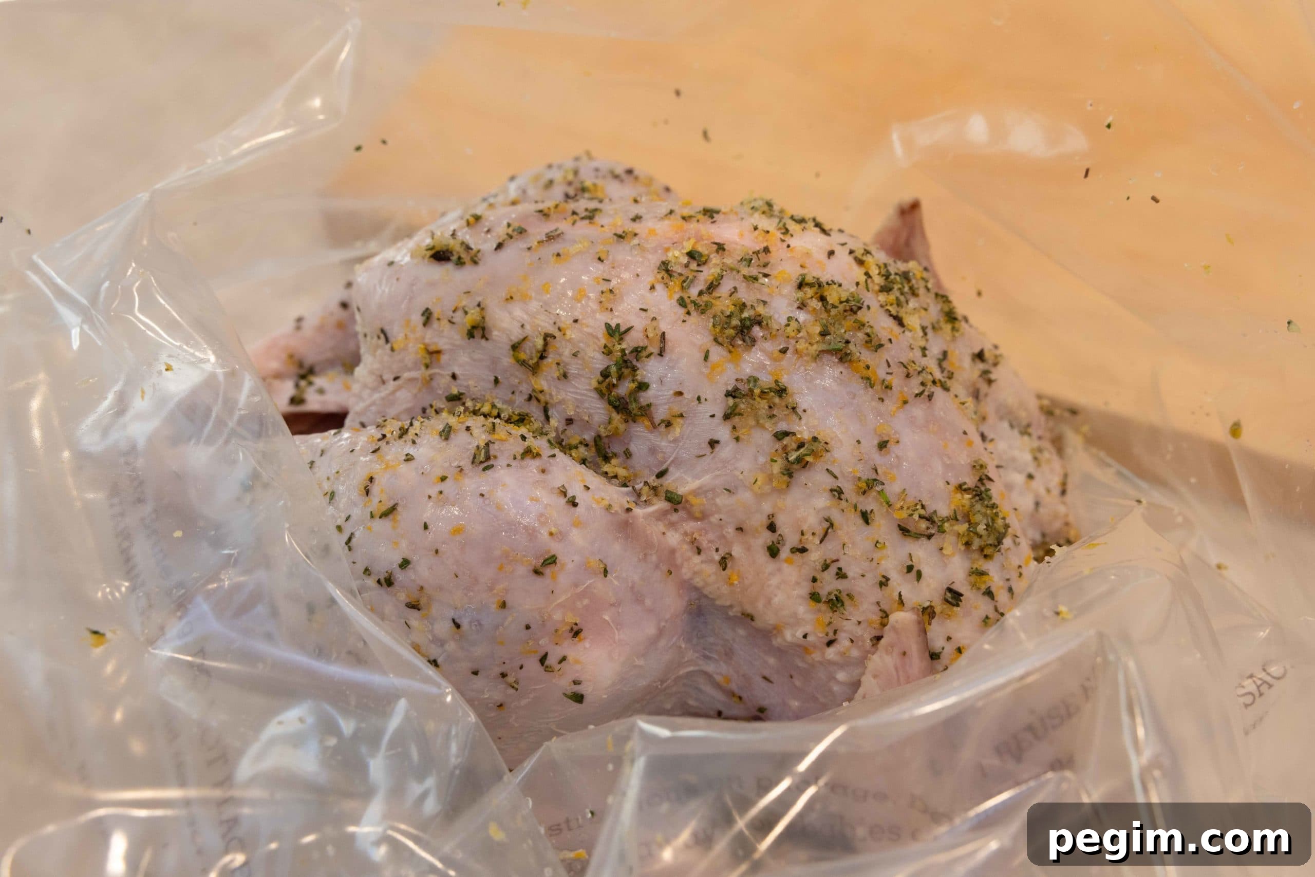 Raw turkey with brine mix in a brining bag.