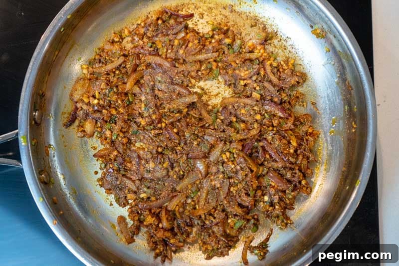 Adding the spices & tomato paste
