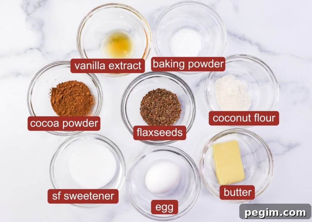 Ingredients including egg, sweetener, butter, flaxseeds, cocoa powder, baking powder, vanilla extract