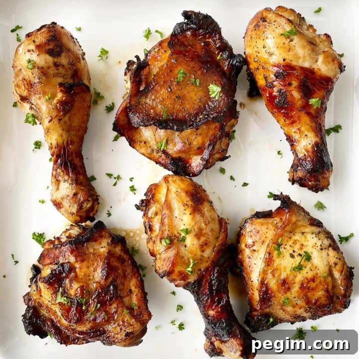 cooked marinated chicken on a white plate