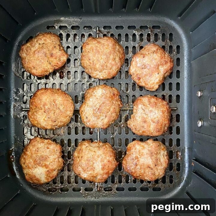 cooked breakfast sausage in the air fryer basket