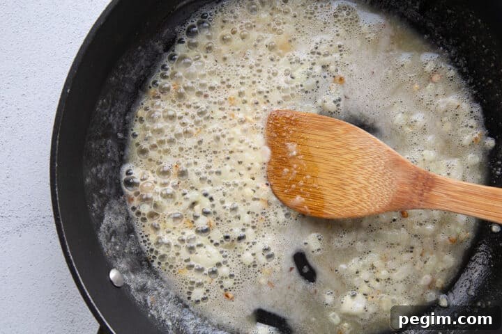butter, flour, and onion in a large skillet with a wooden spoon.