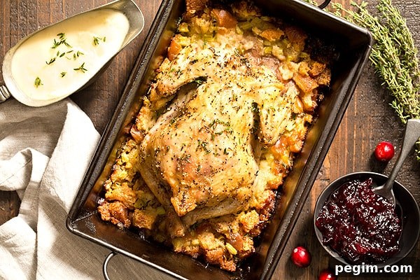 Cornish hen in roasting pan with stuffing