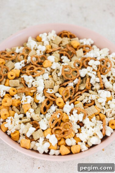 vegan and gluten-free chex mix in a large pink bowl