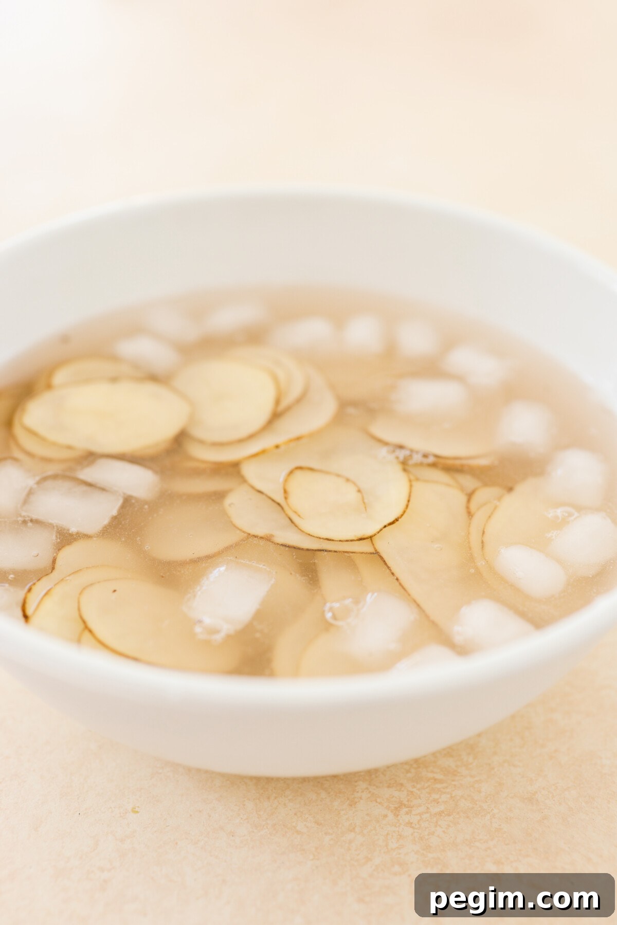 potatoes in a bowl of ice water