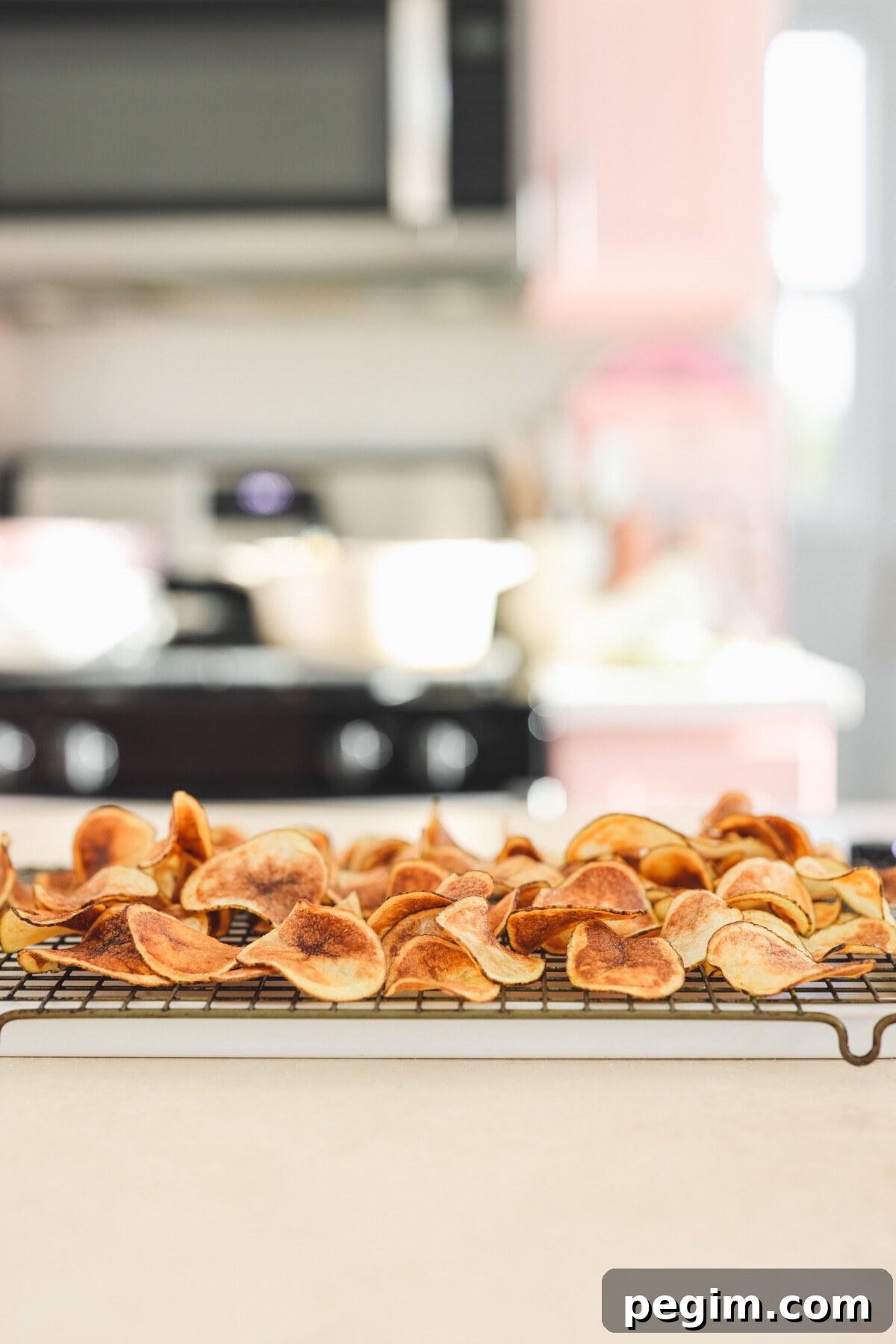 spicy potato chips cooling on a wire rack