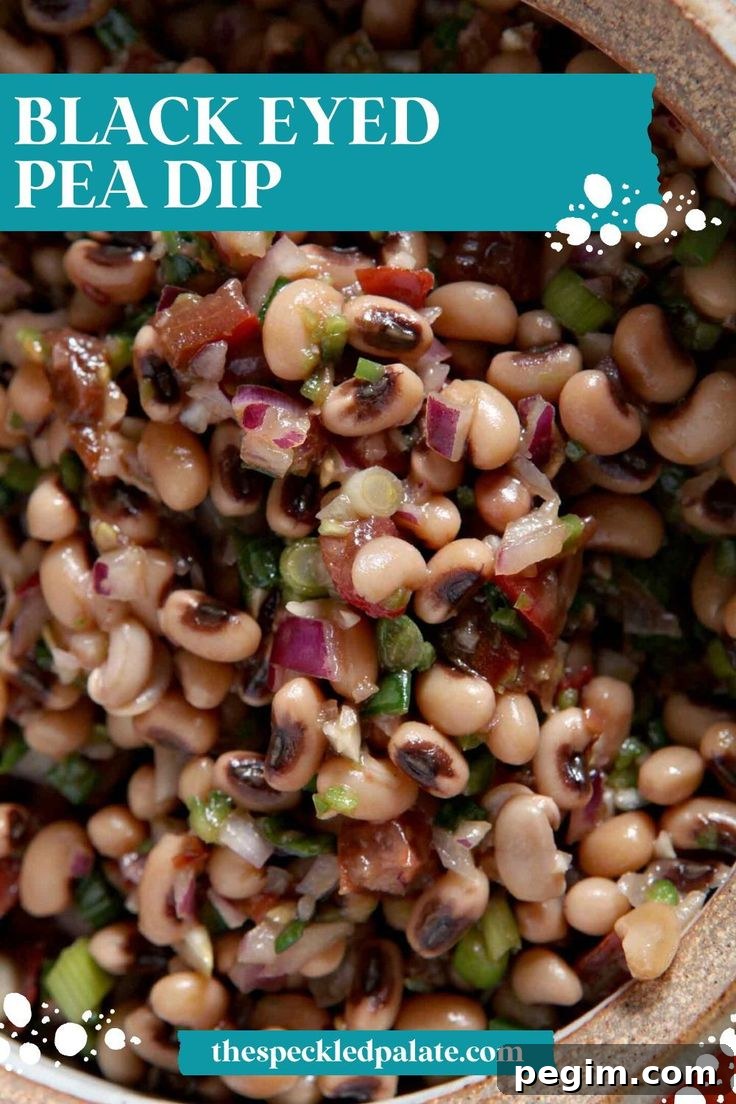 Overhead close up of Black Eyed Pea Dip in a bowl with the text Black Eyed Pea Dip
