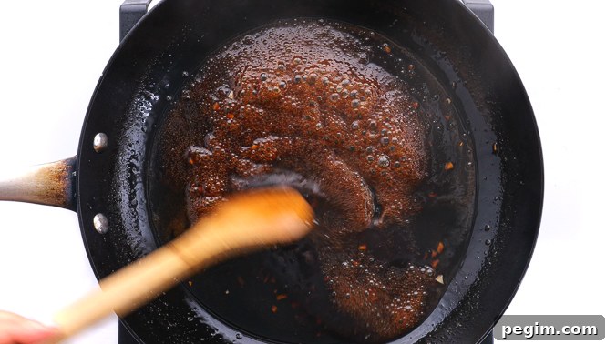 simmering teriyaki sauce in large skillet