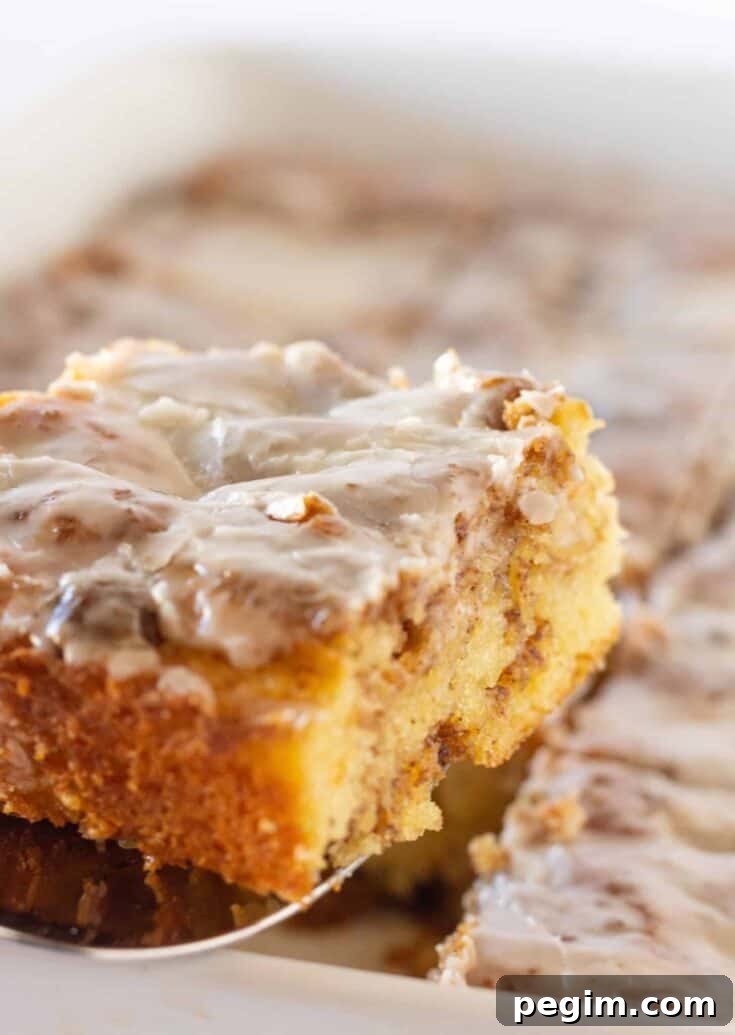 Easy Cinnamon Roll Cake Recipe Made with a Cake Mix by top US food blogger, Practically Homemade