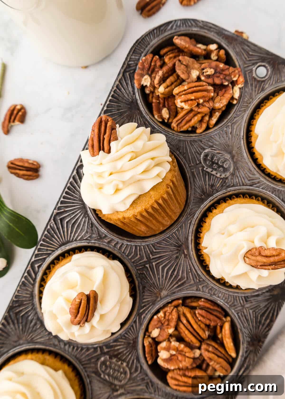 Pecan pie cupcakes in a muffin pan.