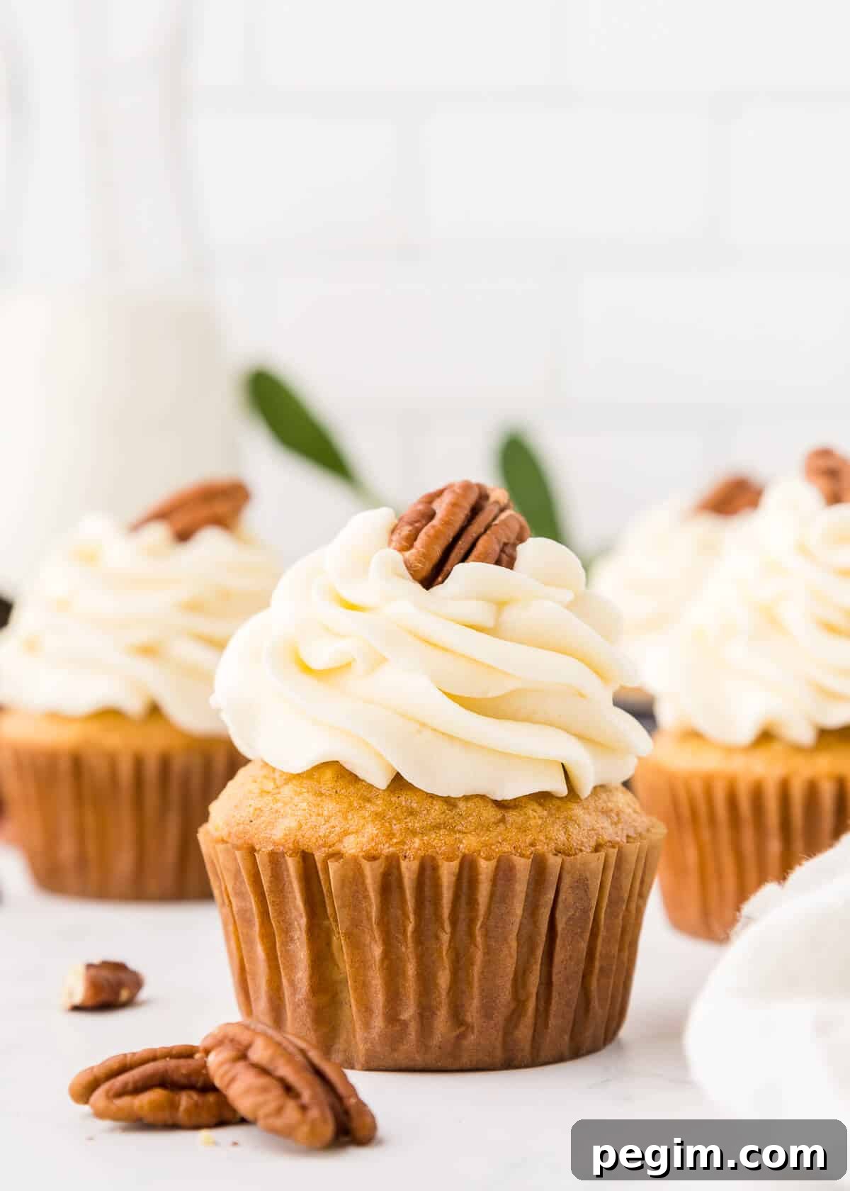 The cupcakes on a white surface.